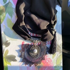 Hand made necklace connected with silk flare